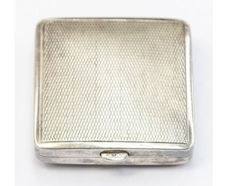 An art Deco silver compact, cushion shaped with engine turned decoration, approx 42mm x 42mm, containing mirror to the lid, g