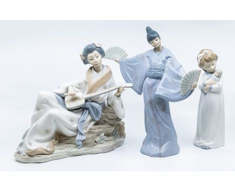 Two Japanese figures of ladies and a small girl with doll, all Nao figures`