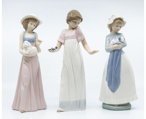 Three Nao figures of young ladies