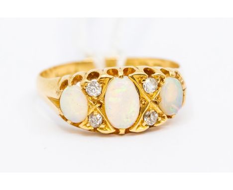 A Victorian opal and diamond ring 18ct gold, comprising three oval opals with alternate diamond accents, size O1/2,  total gr