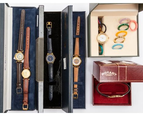 A ladies Gucci gilt metal wristwatch in box with reversible bezel mounts, two Burberry watches, both boxed, a Rotary ladies w