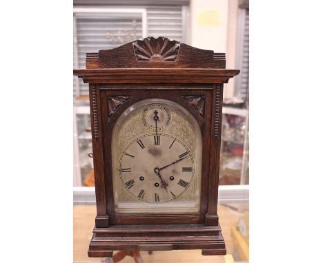 An early 20th Century eight day bracket clock, having a Westminster chime, spring driven movement, silvered dial, with engrav