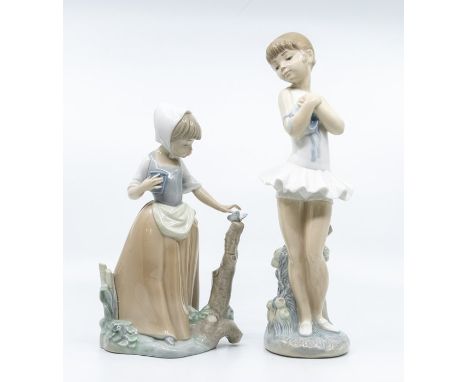 Two Nao figures, ballet dancer and girl with a butterfly