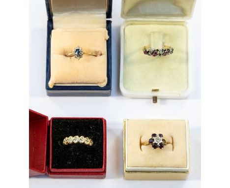 A collection of four 9ct gold rings to include an early 20th century ruby and diamond eternity ring, size P, (stones missing)