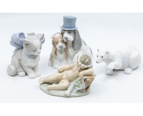 Three Nao figures, dogs and cat, with a cherub and a polar bear un related