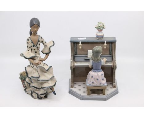 Two Lladro figures, one is a girl playing piano and the other is a Flamenco dancer (AF)