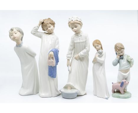 Five Nao figures of young children ready for bed