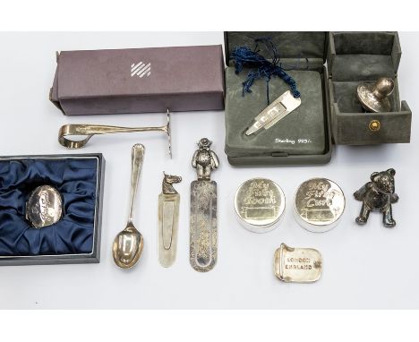 A collection of silver items to include&nbsp; a baby's novelty dummy, two page book marks one with a horse head, a spoon and 