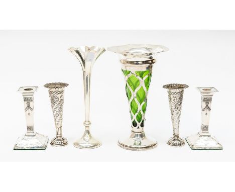 A collection of silver to include: A pair of Edwardian Neo-Classical style desk candlesticks, by Fordham &amp; Faulkner,, She