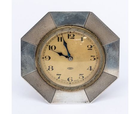 An Art Deco silver mounted 8 day desk clock, inset with a brass clock, round cream dial with number markers, dial diameter ap