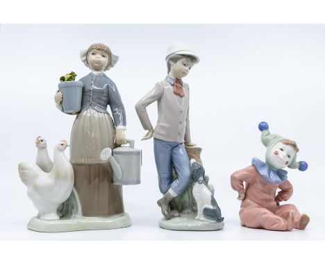 Two Nao figures of young boy with dog, boy dressed as clown and Lladro Dutch boy
