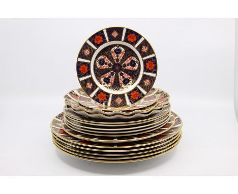 A collection of Royal Crown Derby 1128 small, medium and large plates including fan plates, first and second quality
