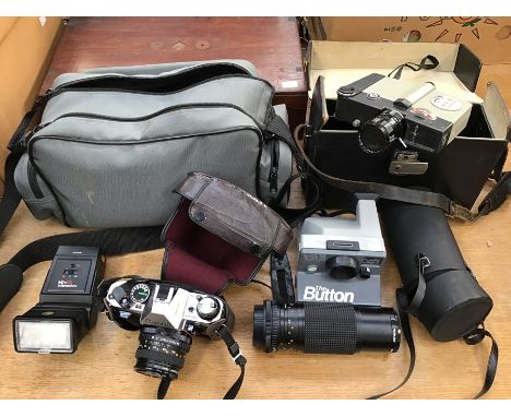 A collection of assorted cameras comprising Sanyko 8cm camera with lens, Bell &amp; Howell lens with case, a Canon AE-1 camer