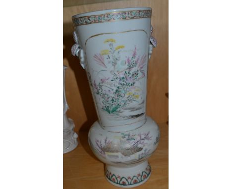 A Japanese Kutani porcelain vase, late Meiji period, the slightly tapering neck with twin flower handles, above a bulbous bas