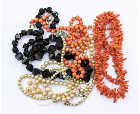 Two coral necklaces, two simulated pearl necklaces and a jet bead necklace