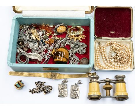 A collection of costume jewellery to include a tigers eye egg, (flaw to one side) paste set costume brooches, opera glasses, 