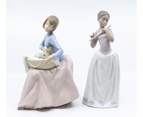 Two Nao figures of young ladies, one with baby