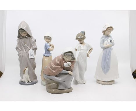 A collection of five Nao figures of young children