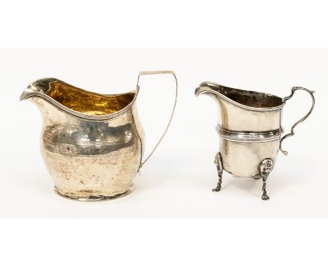 A George III silver helmet shape cream jug, bright cut engraved, marks rubbed, London, circa 1805 together with a Georgian st