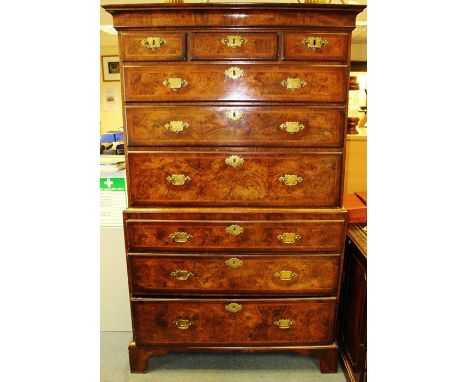 A George I walnut chest on chest, circa 1720, the upper section with three short drawers over three long graduated drawers, t