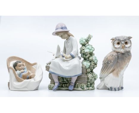 Three Nao figures, girls with bird, owl, baby in chair