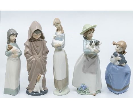 Five Nao figures of young children with animals