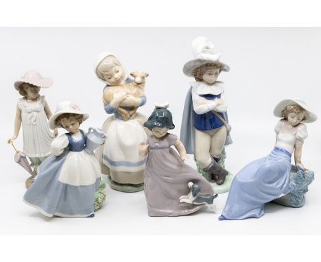 A collection of six Nao figures of young children