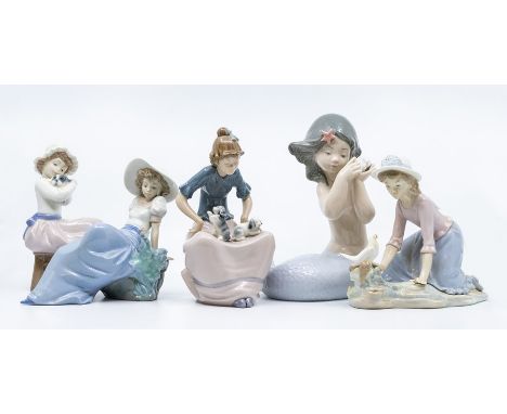 Nao figure of mermaid and four other Nao figures of girls with birds and dogs