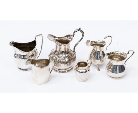 A collection of silver to include: George III bright cut engraved helmet shaped cream jug, London, circa 1805, marks indistin