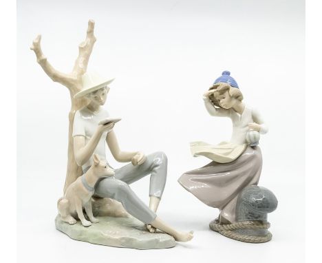 Two Nao figures, boy under tree and girl at docks