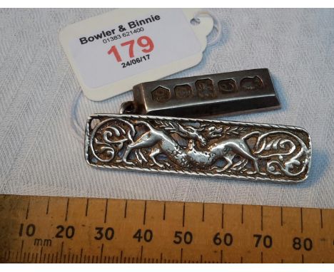 Silver ingot together with silver Celtic design brooch 