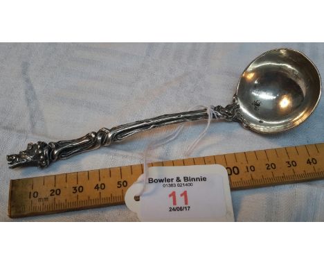 A Victorian London silver ornate gravy ladle with boar head design. 15cm long 