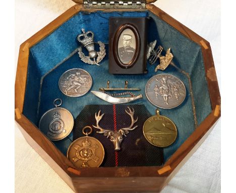 A hardwood box containing vest case, 5 army sporting models & brooch etc 