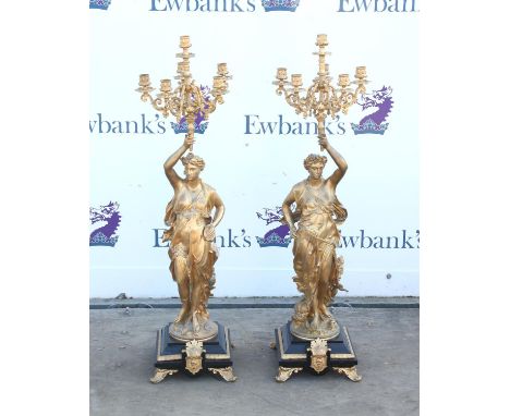 Pair of 19th century style gilt metal and slate figural candelabra, with female figures holding up six light torches on mould