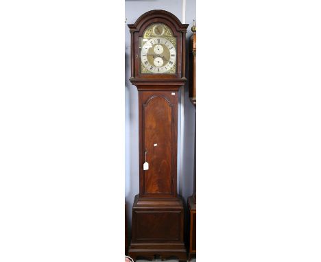 Mahogany eight day longcase clock, the arched hood with fluted pillars enclosing a brass dial with strike/silent and dolphin 