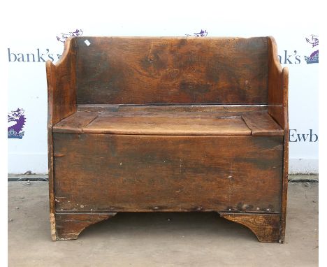 18th century elm provincial bench, of planked construction with hinged seat and bracket feet, H78 W98 D43 cm