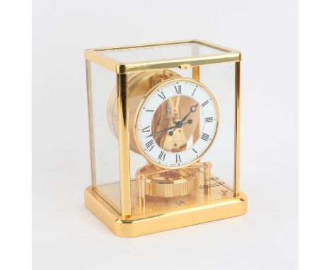 Jaeger LeCoultre brass framed Atmos clock, with silvered dial, numbered 643952, with 13 jewel movement, with manual, 23 cm hi