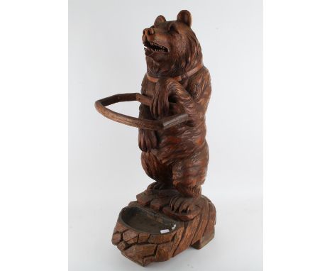 Late 19th/early 20th century Black Forest Bear stick stand, the standing on his back legs with a front paw extended, H90cm W3