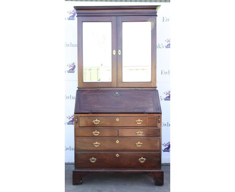 George III mahogany bureau bookcase, the later bevelled glazed pair of doors enclosing shelves pigeonholes and drawers, over 