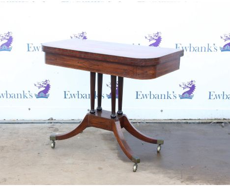 Regency mahogany and ebony strung foldover card table, the crossbanded rounded rectangular top on reeded tapering supports  a