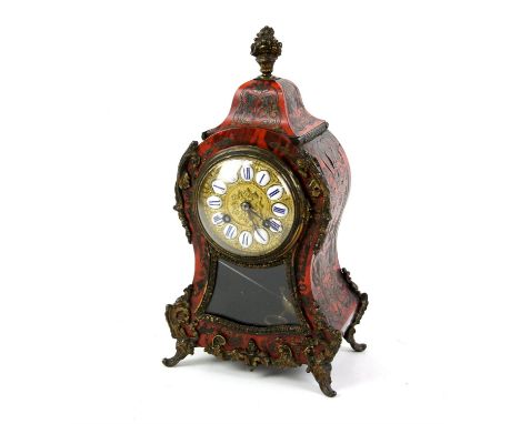 19th century French boullework table clock, with metal mounts and enamel chapters, of waisted form  and with a French twin tr