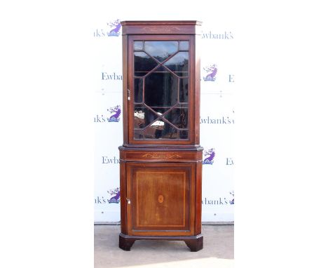 Early 20th century and marquetry inlaid floor standing corner cabinet with astragal glazed door over panelled  door on bracke