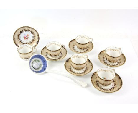 Set of Six Davenport tea cups and saucers, in underglaze blue with mocha band and gilt foliate decoration, the interiors pain