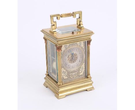 Early 20th century brass carriage clock, inscribed J. Hall & Co., the ivorine and silvered dial depicting cupid, torches and 