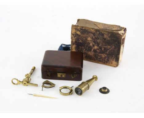 Gould's Pocket Compound Cary Type Microscope, with brass parts and ivory sample slides. The microscope mounting onto a mahoga