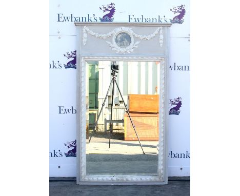 Early 19th century painted pier mirror, the frieze applied with floral garlands and a circular glazed panel mounted with a pr