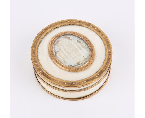 19th century ivory and tortoiseshell circular box with gilt metal mounts, the cover with a carved and pierced ivory arch fram