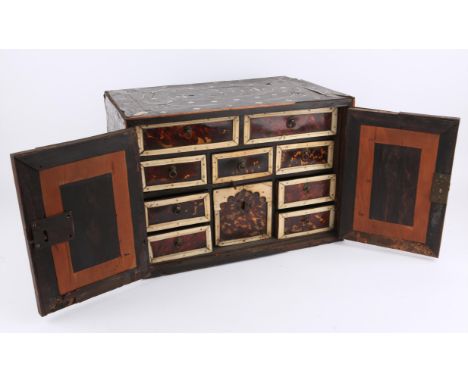 Ebony and bone inlaid cabinet of curiosities with internal drawers and cupboards, with fossils, hat, seed pod and other items