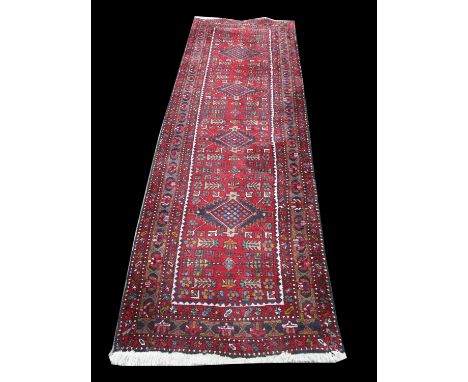 Persian Heriz runner, with rich red ground, heavy piled, , 359 x 107 cm