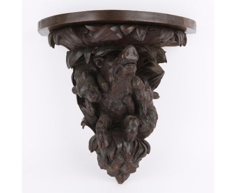 Late 19th/early 20th century Black Forest wall bracket carved with hounds and a wild boar, 40 cms wide by 44 cms highPROVENAN